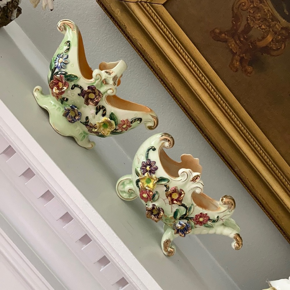 Vintage and rare hand painted porcelains. Price is for the pair
